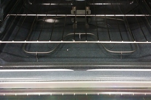 Inside of an oven with heating coils on the bottom.