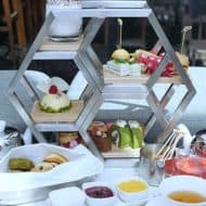Afternoon tea set served on a unique Hexagonal display.