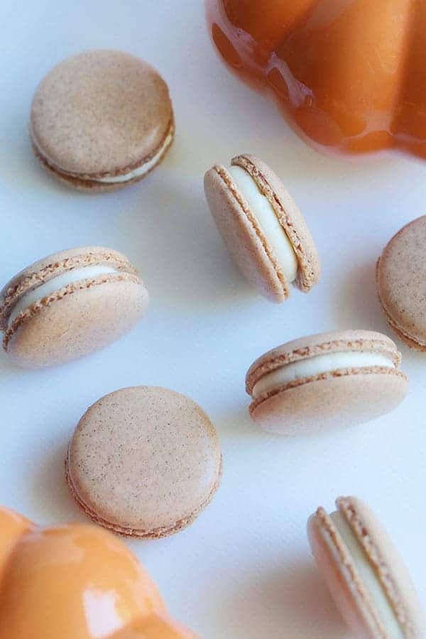 Scattering of pumpkin spice cheesecake macarons. 