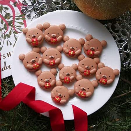 Christmas bear macarons holding presents. 