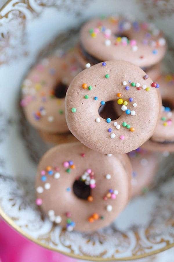 Close up of multi-colored sprinkles on macarons.