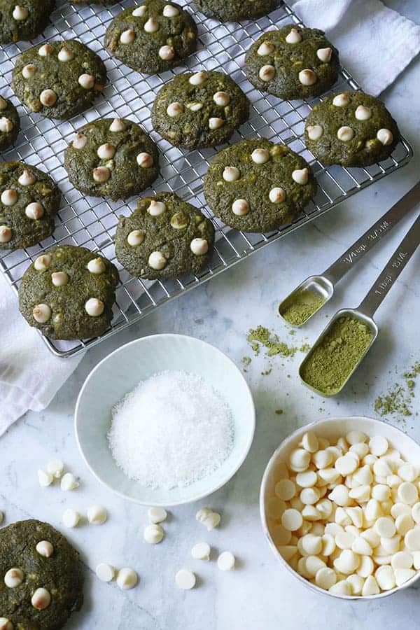 Ingredients for matcha coconut cookies shown with cookies. 