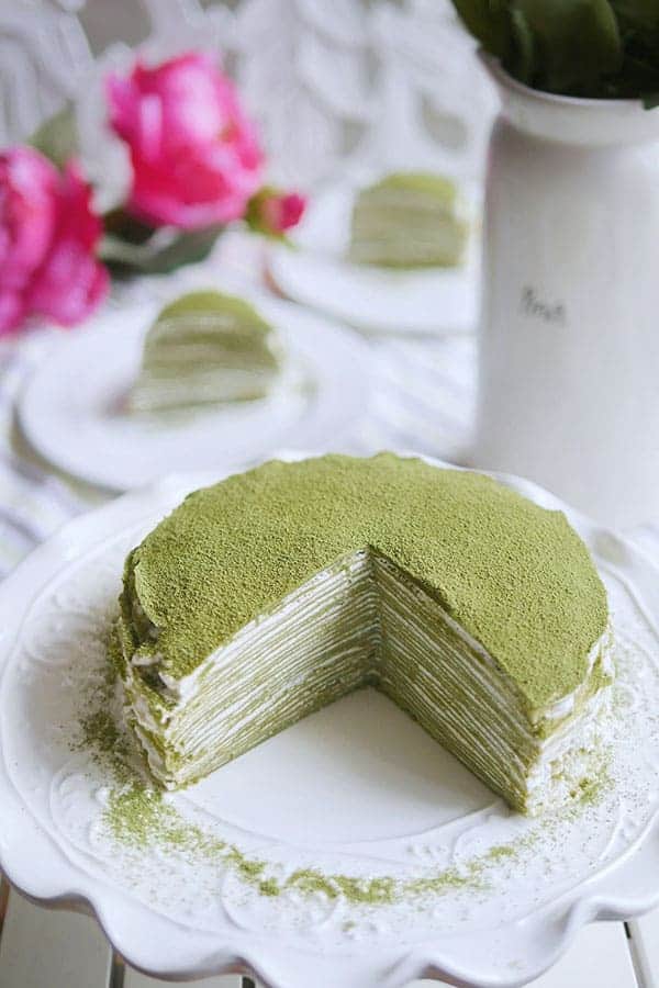 Matcha powder dusted on top of the 28 layer mille crepe cake. 