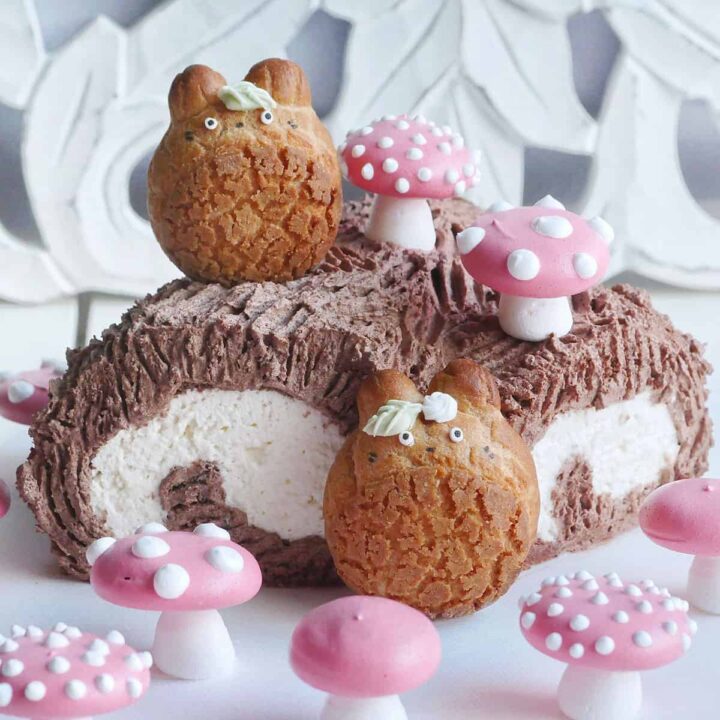 Totoro cream puffs perched on top of a Japanese chocolate yule log.