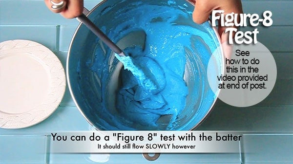 The batter is dropped with a spatula in a figure-8 pattern inside a mixing bowl. 