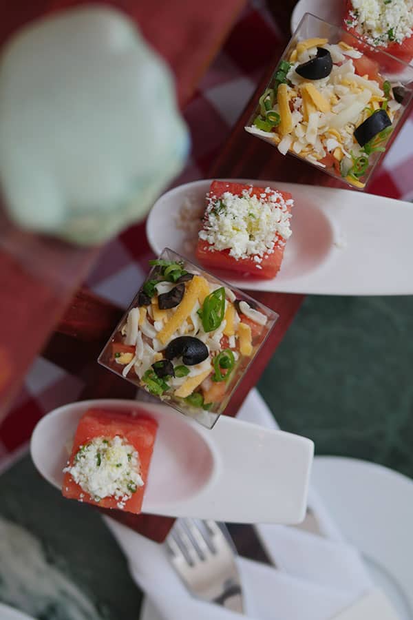 Watermelon cube with goat cheese.