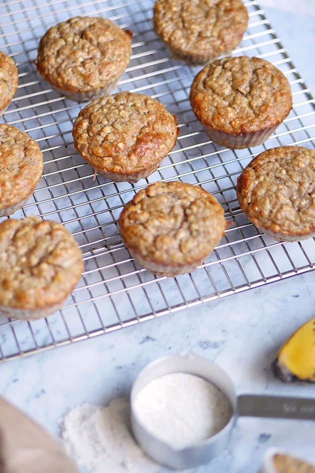 Einkorn muffins cooling on a rack. 