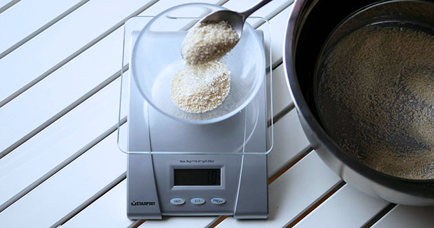 Weighing almond flour with a scale. 