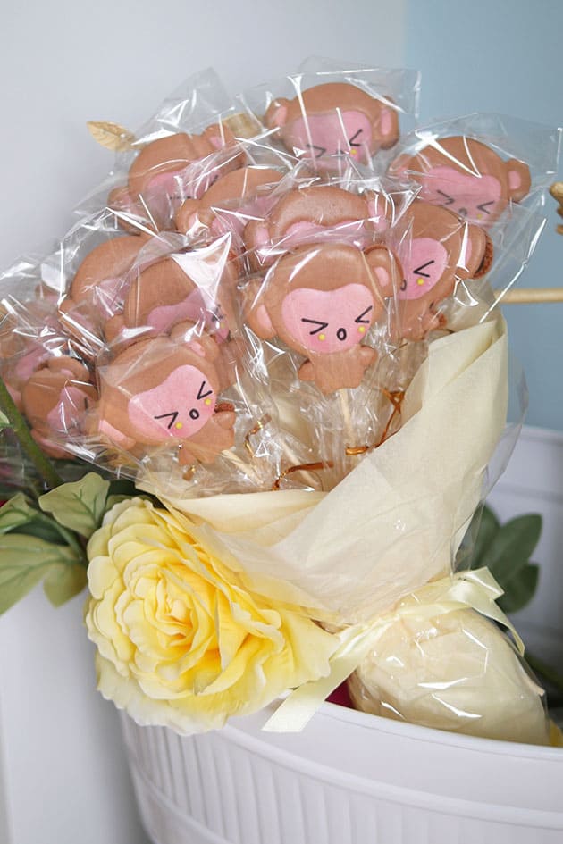 Monkey shaped macarons individually wrapped in a bouquet. 