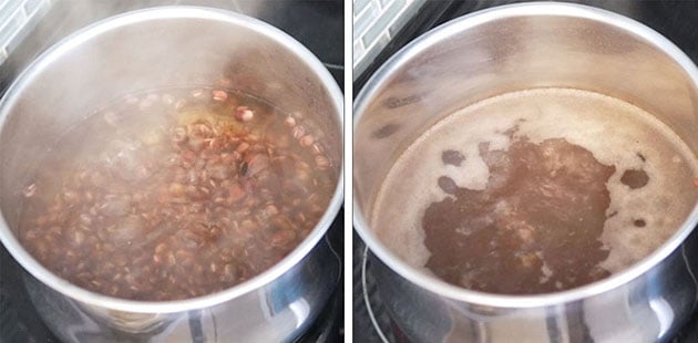 Red beans boiling in a pot with steam coming out. 