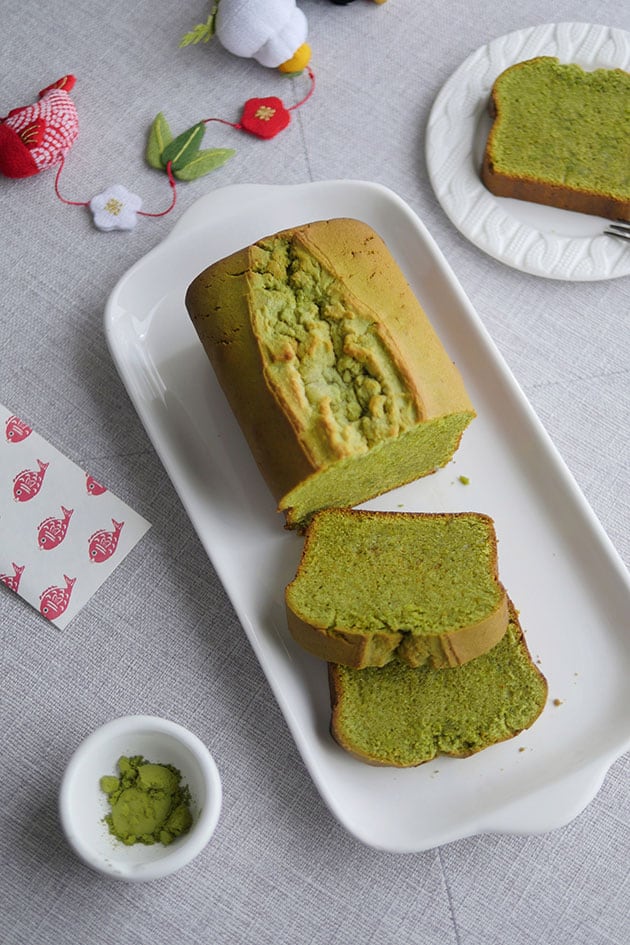 Top view of matcha pound cake with some slices cut out.