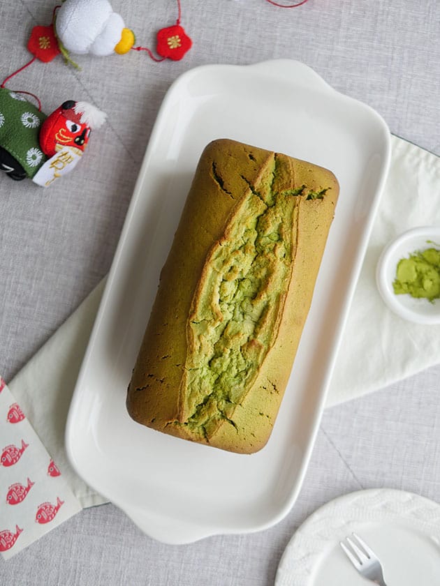 Bird's eye view of matcha cream cheese pound cake with a perfect center crack. 