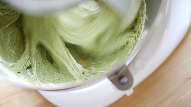 Pound cake batter is now green after the addition of matcha dry mix. 