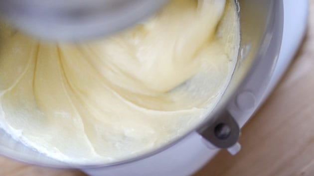 A smooth creamy pound cake batter in mixing bowl.