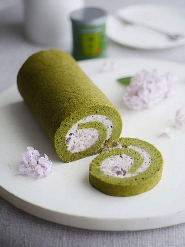 A matcha cake roll filled with red bean whipped cream. 