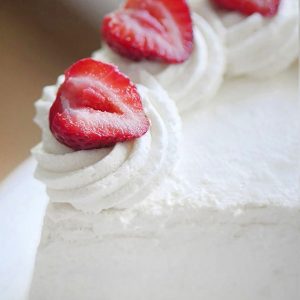 Close up of whipped cream piped into a swirl pattern.