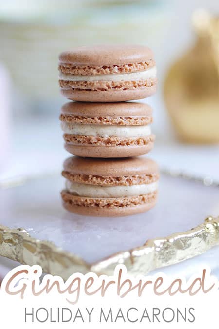 A stack of 3 gingerbread spice macarons on a plate.