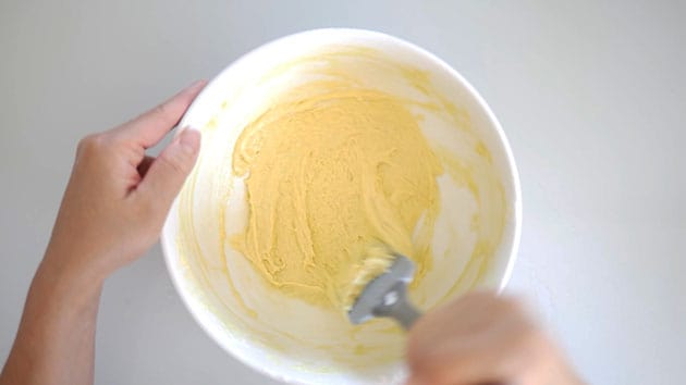 Macaron batter being folded. 