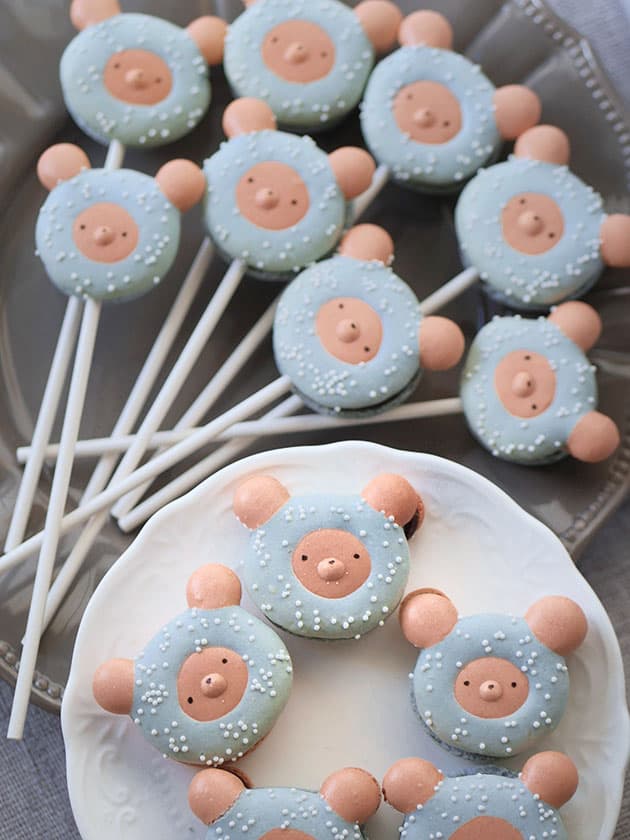 Bear macaron lollipops on a plate. 