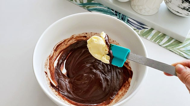 Butter being added to chocoalate macaron filling. 