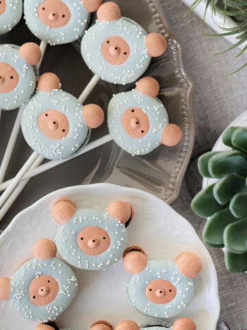 Top down view of macaron lollipops filled with chocolate filling.