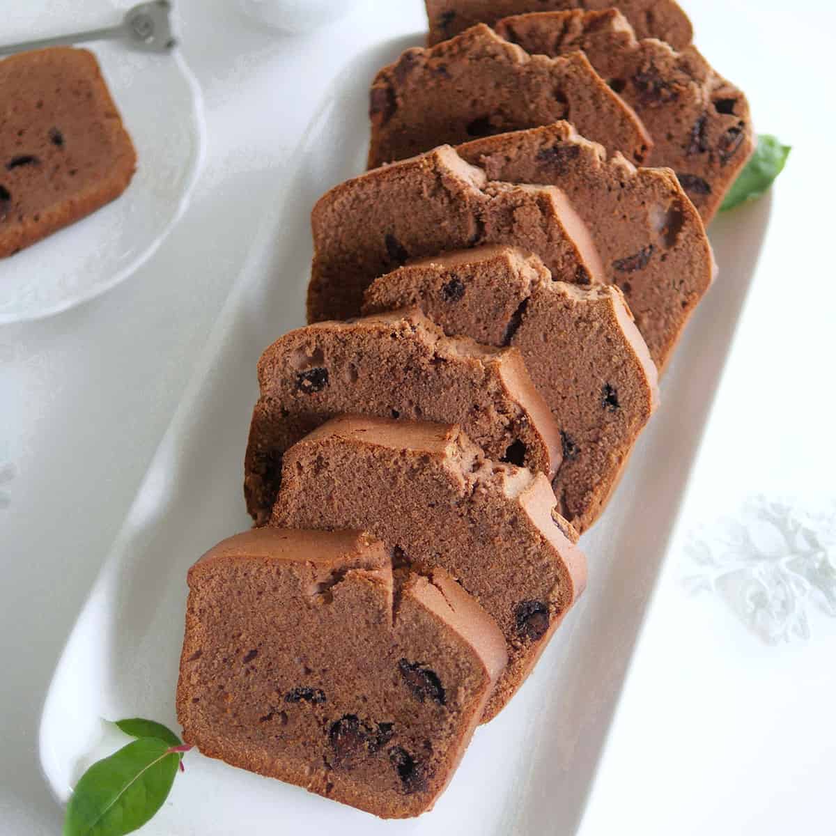 Tender cream cheese pound cake slices on a long plate.