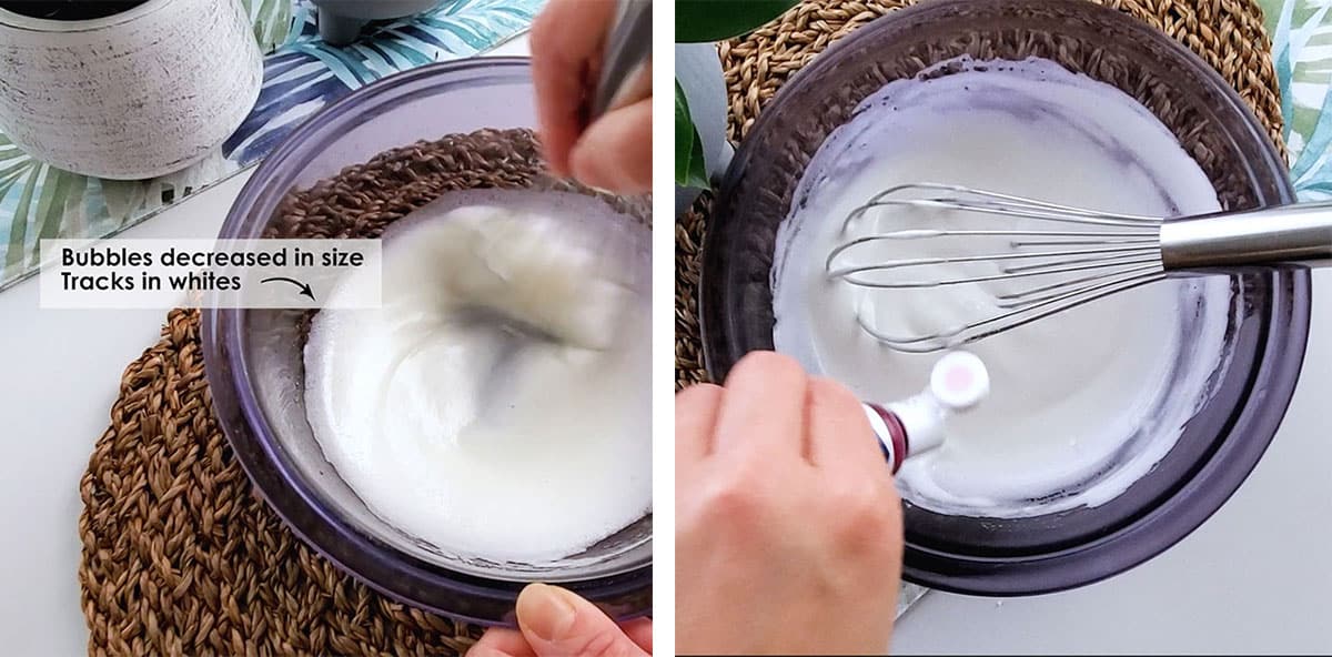 A hand dropping food coloring into a bowl filled with meringue. 