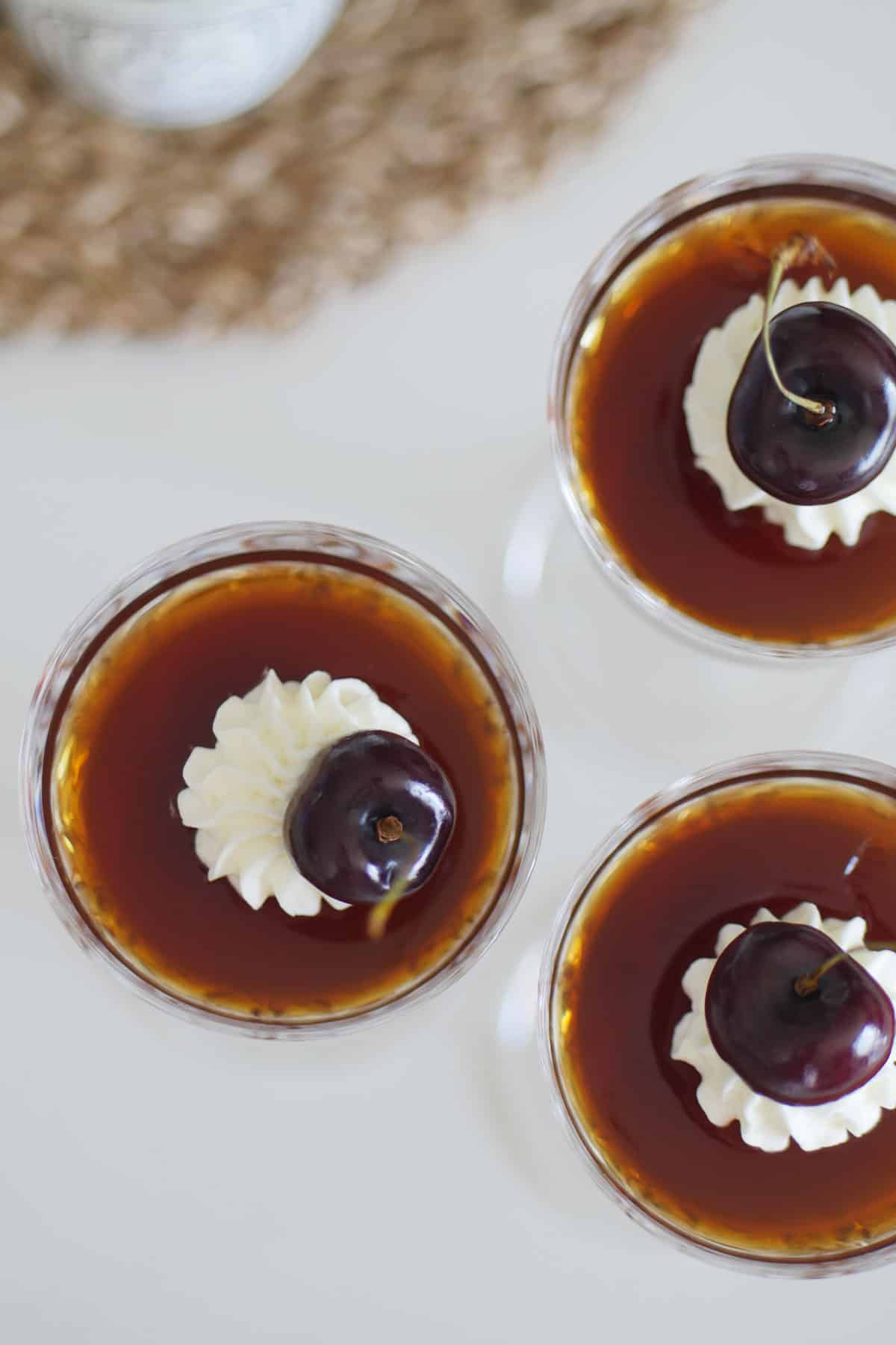 Top down view of coffee jelly in glasses.