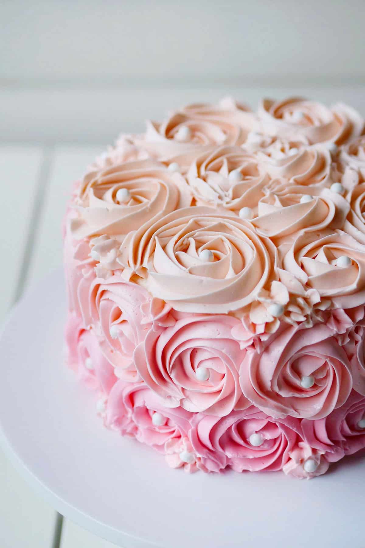 Close up of floral buttercream cake.