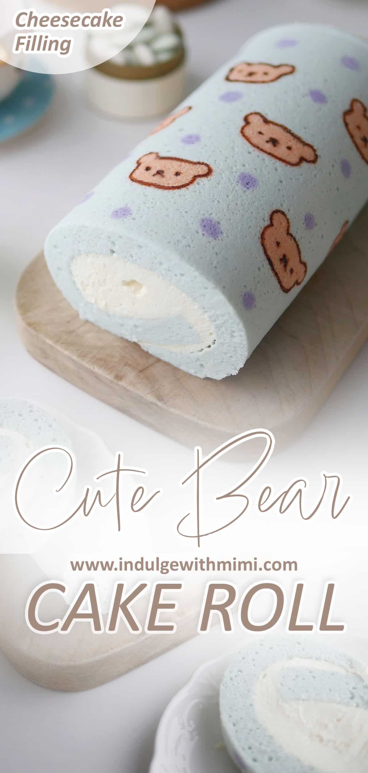 Blue cheesecake roll with cute bears printed on top placed on a long wooden serving plate. 
