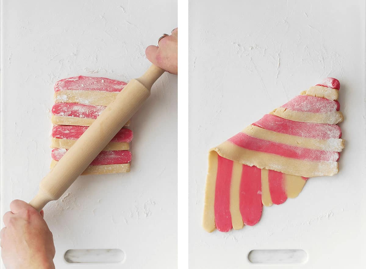 Strips of colored and non-colored cookie batter are laid out in an alternating pattern and then rolled out and flipped on an angle. 