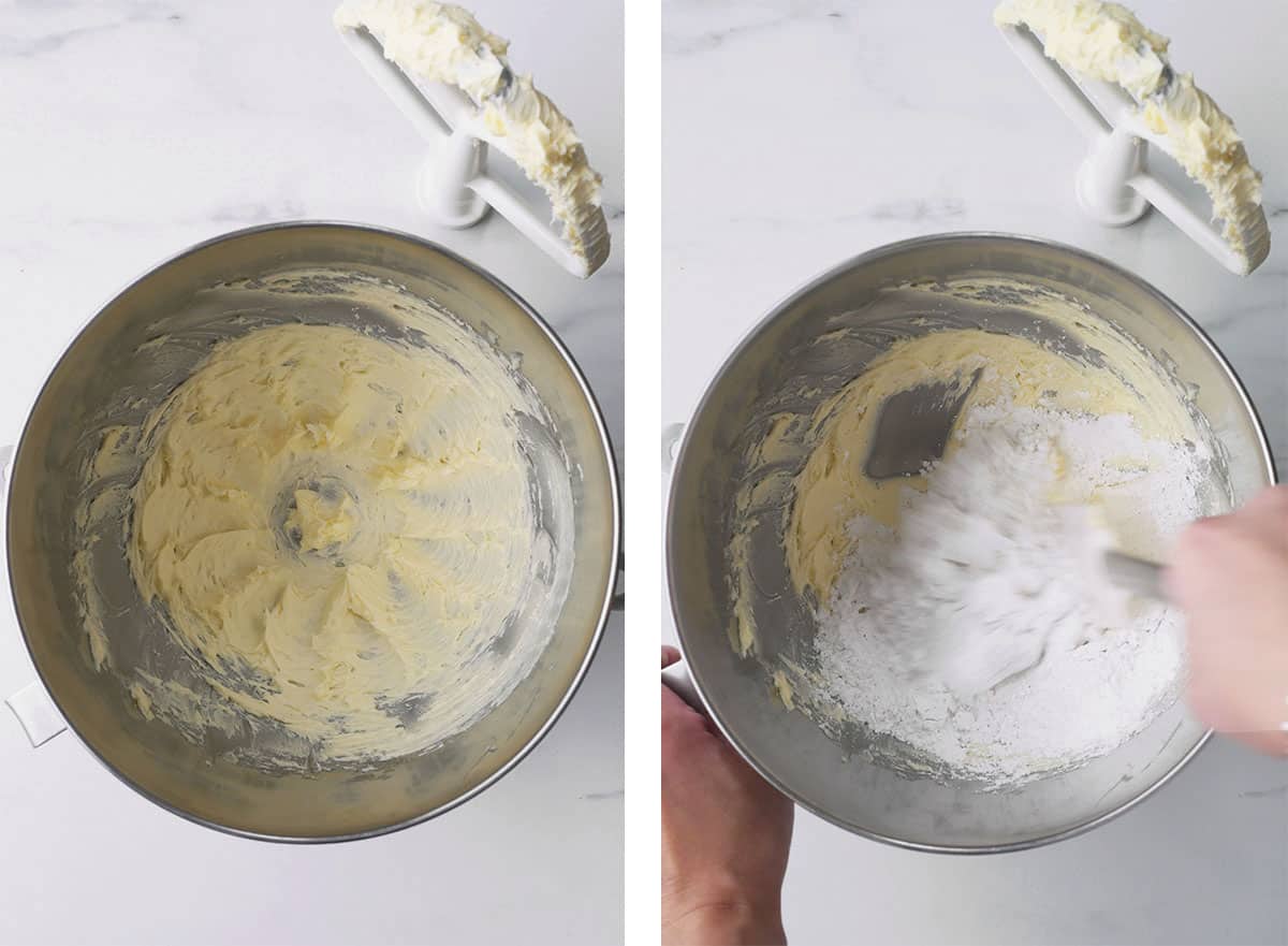Creamed butter in a mixing bowl and powdered sugar being added. 