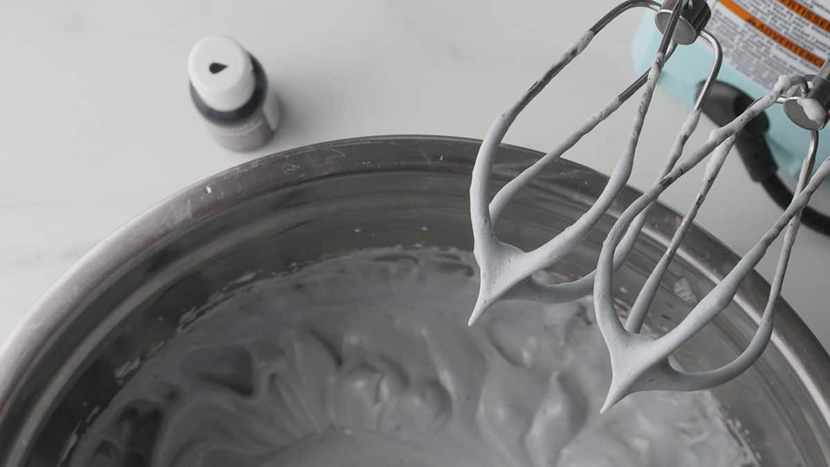 Stiff peaks of the meringue is shown once the beater is pulled out. 