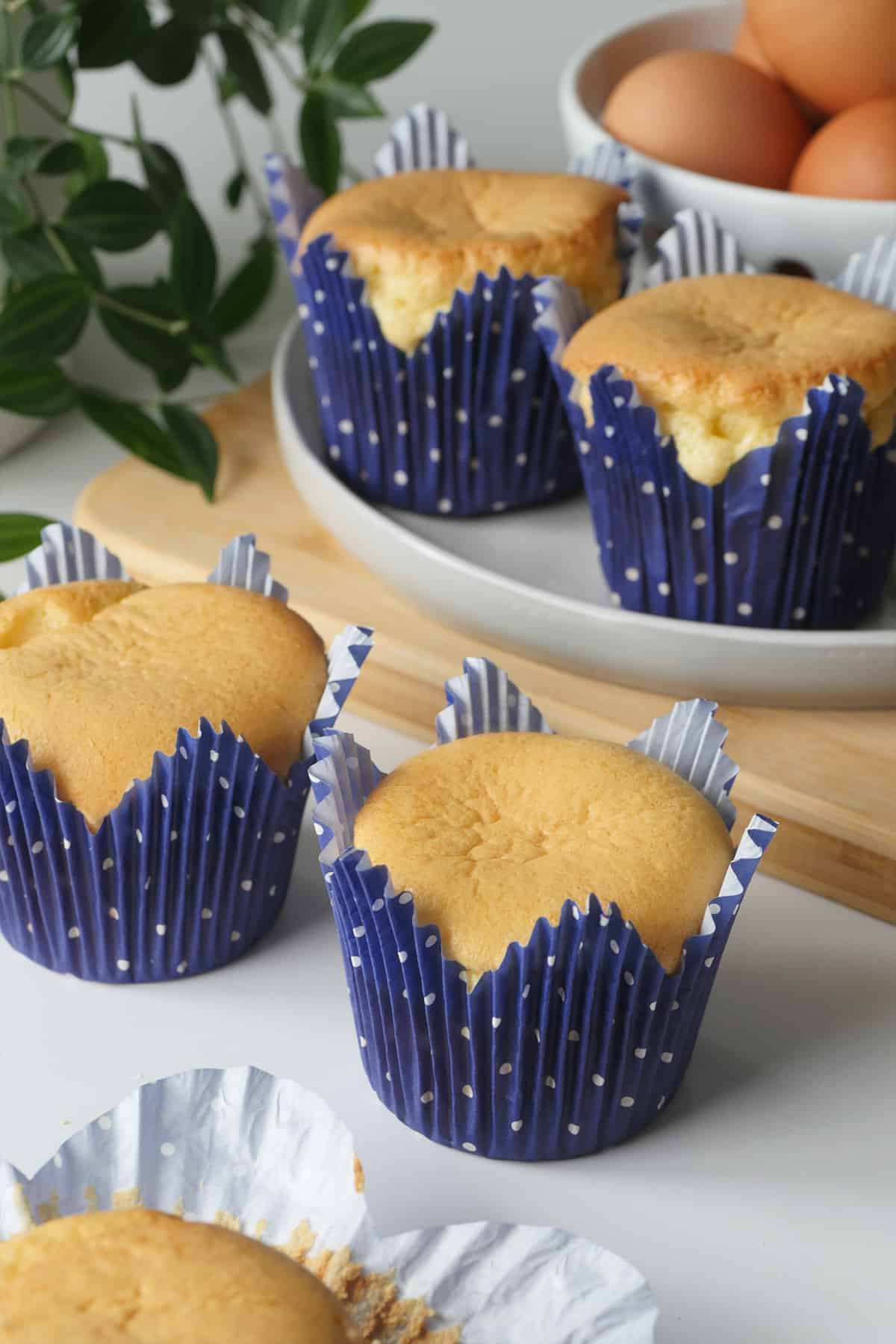 Four spongey cupcakes baked in elegant tall tulip cupcake wrappers. 