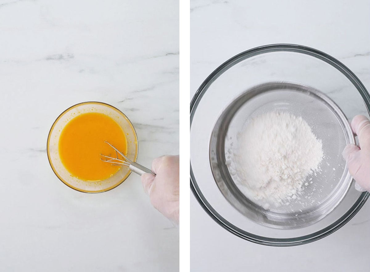 In a small bowl, egg yolks, oil and extracts are being stirred together. In a large bowl, a hand is sifting cake flour. 