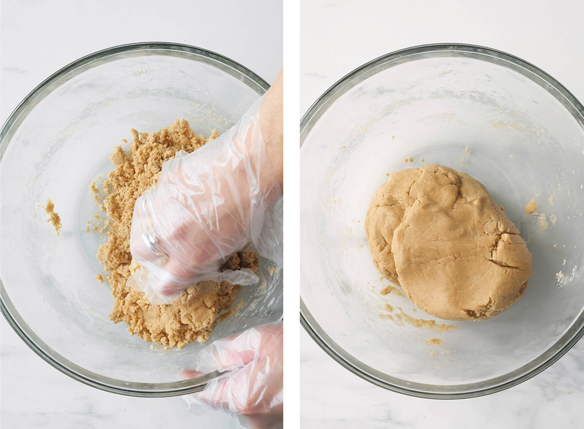A hand is kneading the loose cookie dough into a dough ball. 