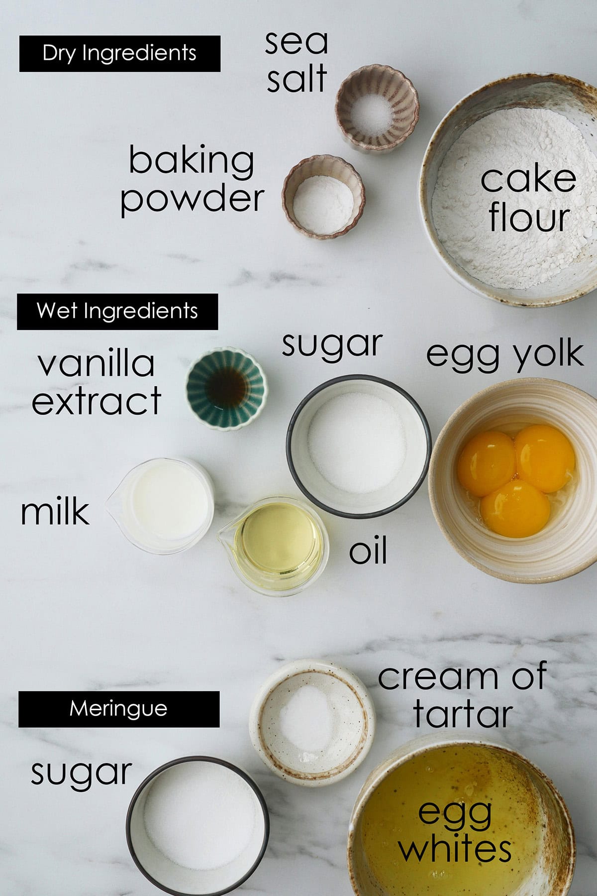 Ingredients for Japanese Chiffon Cake Roll on a marbled counter. 