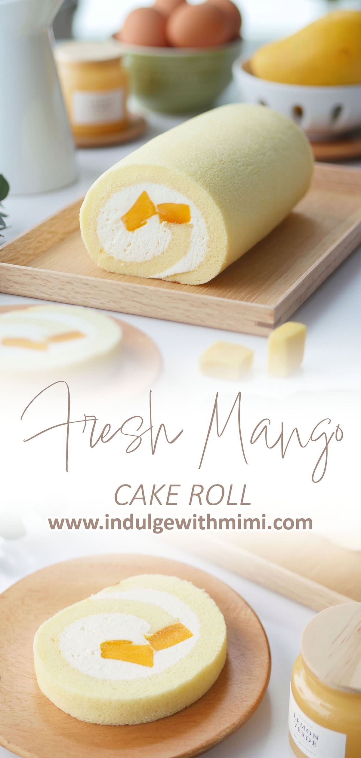 A fluffy looking cake roll is shown on a serving tray showing the side profile revealing whipped cream and fresh mangos. 