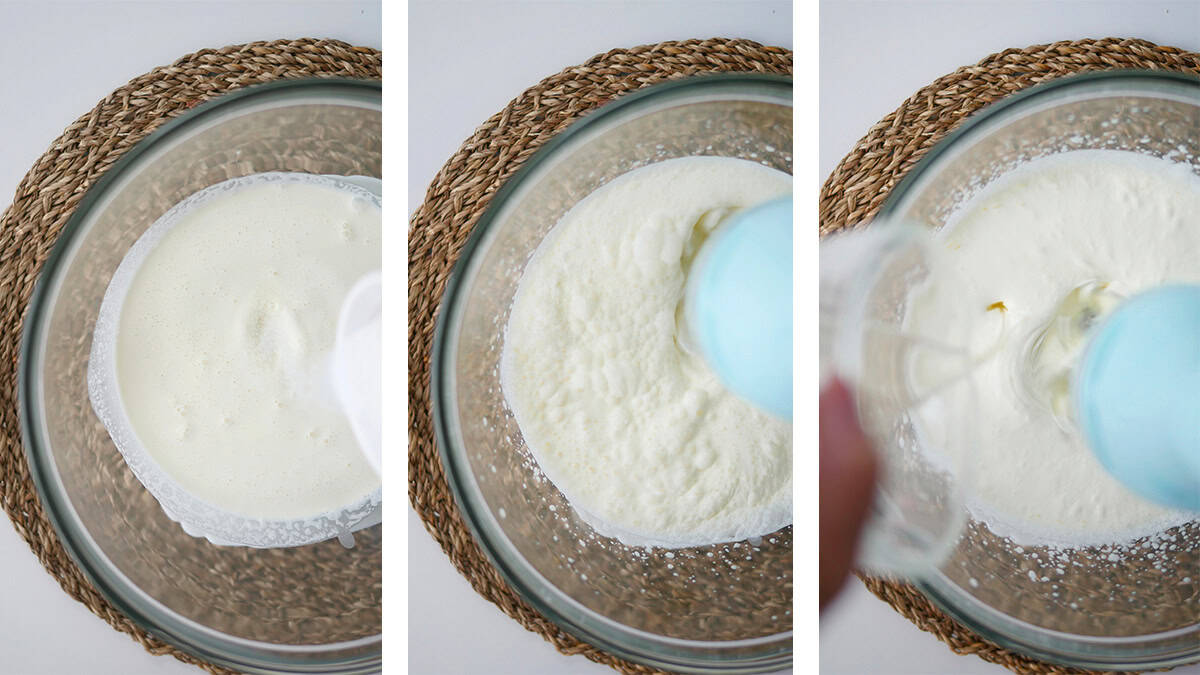 Handheld mixer is whipping cream and liquid gelatin is being poured into the bowl at the same time. 