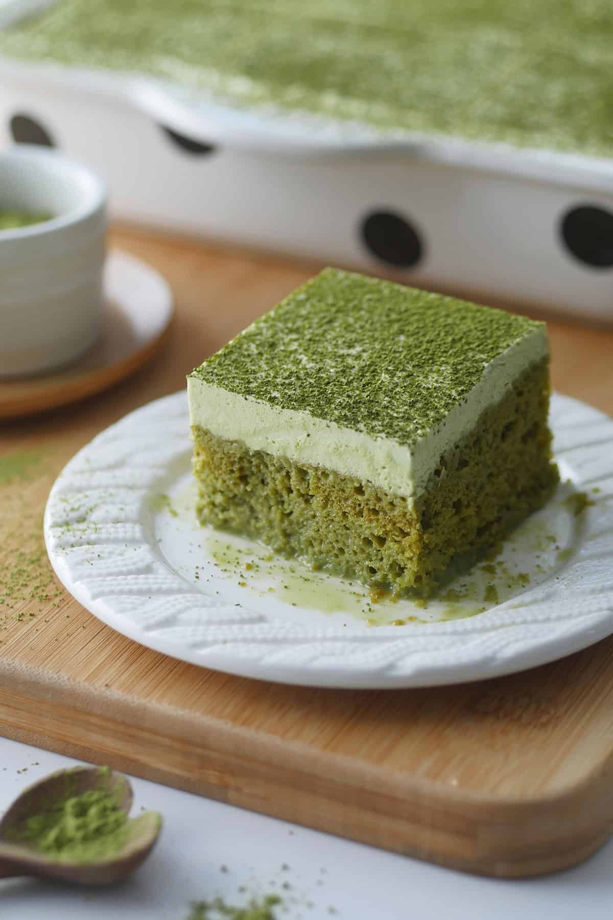 A close up shot of a square piece of Tres Leches cake showing the open crumbs in this dessert.