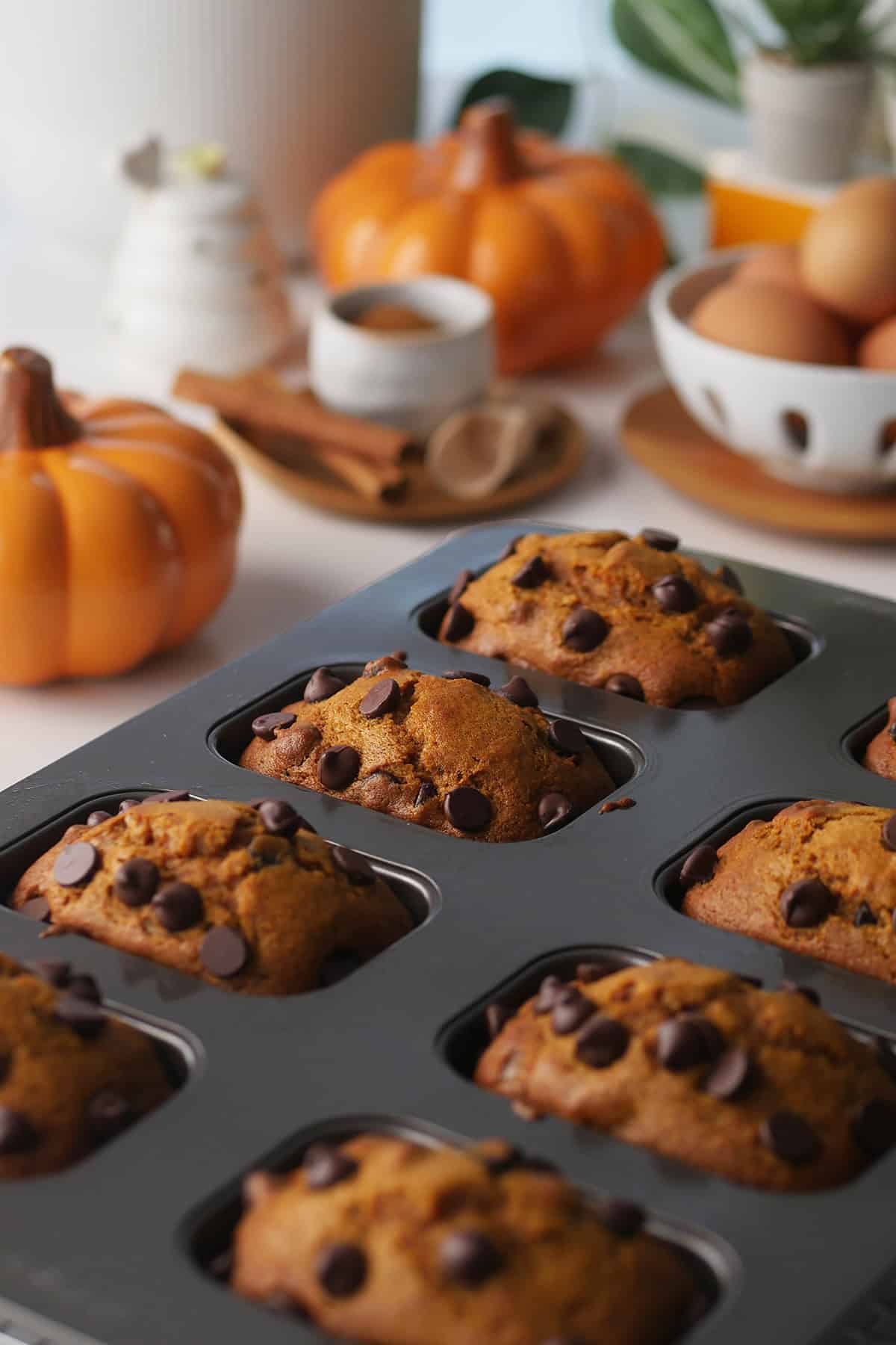 In focus view of mini pumpkin cake loaves inside the cake pan as viewed from the side. 